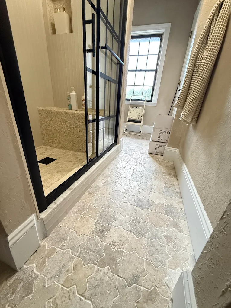 Arabesque travertine mosaic tile floor — natural stone tile installation by Cullinan Tile in Sarasota
